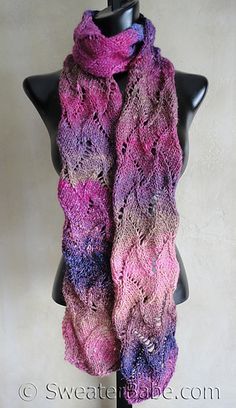 a pink and purple knitted scarf on a mannequin