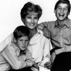 an old black and white photo of two boys with one boy smiling at the camera