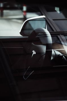 the interior of a car is shown with its dashboard mirror partially covered in stickers