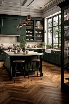 a large kitchen with green cabinets and wooden flooring, two stools at the island