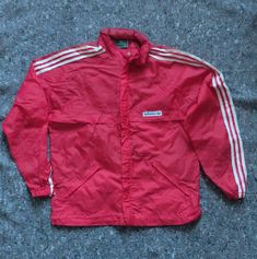 Vintage Adidas rain/wind jacket Early 80s 3 pockets Foldable hood Ventilated back Some light stains are present due to its age Size XS(height 162 cm) Length 64 cm Width(pit to pit) 53 cm Sleeve 73 cm Adidas Vintage, Wind Jacket, Light Stain, Vintage Adidas, Latvia, Jackets & Coats, Adult Outfits, Adidas, Music Clothes