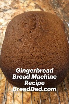 a chocolate cake sitting on top of a wire rack with the words gingerbread bread machine recipe