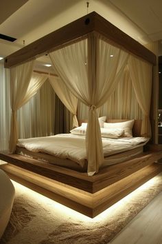 a large bed sitting in the middle of a room with curtains on top of it