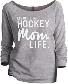 a women's sweatshirt with the words, livn that basketball mom life on it