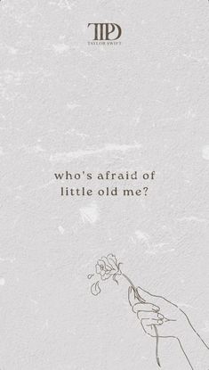 a hand holding a flower with the words who's afraid of little old me?