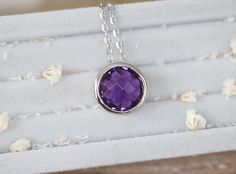 "A stunning collection of sliding necklace featuring a faceted Purple Amethyst handcrafted in sterling silver is a classic staple for any occasion. Belesas and 925 hallmarked on the outside pendant and suspended on a sterling silver 18\" chain. Wrapped in a box ready for gift giving. Necklace Info --------------------------------- Pendant measure 11.5mm Pendant Height with stone 7.5mm Chain Length 18\" Sterling Silver 925 High Quality Rhodium Plated to prevent tarnish --------------------------- Amethyst Bezel Setting Jewelry Gift, Gift Amethyst Bezel-set Jewelry, Classic Amethyst Necklace For Gift, Amethyst Jewelry With Bezel Setting As Gift, Amethyst Jewelry With Bezel Setting For Gift, Sterling Silver Bezel-set Briolette Necklace, Sterling Silver Briolette Necklace With Bezel Setting, Faceted Sterling Silver Necklace For Anniversary, Purple Necklace With Polished Finish As Gift