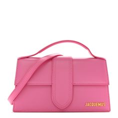 This is an authentic  JACQUEMUS Smooth Calfskin Le Grand in Pink. This super-chic shoulder bag is crafted of smooth leather in pink. The bag features a top handle strap and gold hardware. This front flap opens to a beige fabric interior with a leather pocket. Jacquemus Bag Pink, Jacquemus Bag, Leather Pocket, Beige Fabric, Smooth Leather, Gold Hardware, Top Handle, Calf Skin, Shoulder Bag