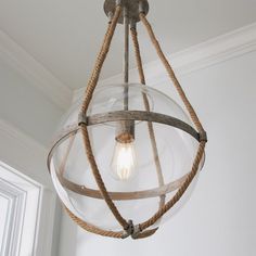 a light fixture with rope wrapped around it