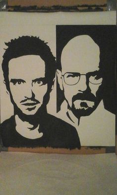 two men with glasses are depicted on a piece of paper that is taped to the wall