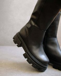 Functionality meets style in this tall boot with a chunky sole and slight elevation.    product type: high boot    platform height: 5 cm    material: leather    color: black    made in spain Flat Black Leather Boots, Elevation Details, Toxic Clothing, Knee High Platform Boots, Random Fashion, Fluffy Socks, High Leather Boots, Sustainable Leather, Tall Boot