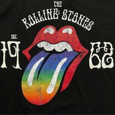 An official licensed The Rolling Stones Ladies T-Shirt featuring the 'Sixty Rainbow Tongue '62' design motif. This high quality T-Shirt is available in a black colourway. High quality soft-style cotton tee with short sleeves and crew neck. Features front printing with puff application to text. Rolling Stones Tshirt, Rolling Stones Logo, The Artist Movie, Rock And Roll Bands, Puff Print, Band Logos, Lip Service, Ladies T Shirt, High Quality T Shirts