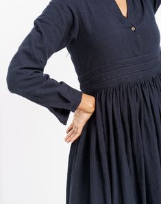 A hint of vintage to your classic black dress. This semi-formal dress fits like a dream with adorable delicate gathers around the waist, relax-fitted long sleeves and overlapping neckline. Tailored from handcrafted organic cotton fabric, this dress is a modern piece with nostalgic sensibility. The fitted empire waistline will let you flaunt your curves elegantly. Elegant Cotton Dresses For Gatherings, Elegant Long Sleeve Dress For Gatherings, Elegant Cotton Midi Dress With Gathered Neckline, Midi Dress With Gathered Neckline For Gatherings, Long Sleeve Dress With Gathered Sleeves For Gatherings, Cotton Dresses For Fall Gatherings, Fall Dresses With Gathered Sleeves For Gatherings, Cotton Dress For Gatherings In Fall, Fall Cotton Dress For Gatherings