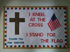 a sign that says i kneel at the cross, i stand for the flag