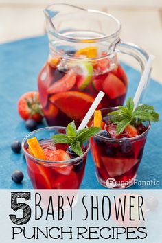 baby shower punch recipe with strawberries, oranges and blueberries in the pitcher