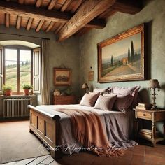 a bedroom with a large bed and painting on the wall next to it's windows