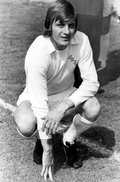 an old black and white photo of a soccer player