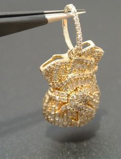 10K YELLOW GOLD DIAMOND CLUSTER PENDANT 1.50 CARAT TOTAL  5.22 grams  PRE-OWNED IN VERY GOOD CONDITION  MADE IN SOLID 10K YELLOW GOLD IT WEIGHS 5.22 GRAMS IT IS 15.79 MM WIDE X 32.79 MM TALL including bale IT FEATURE BAGUETTE & ROUND DIAMONDS APXT. 1.50 CARAT TOTAL  SI2 - I1 CLARITY AND I J COLOR G124713   ABOUT US: RJ JEWELRY was established in 1995. Since then we have grown to have 4 stores centrally located in metropolitan Chicago area. We are member of BBB (Better Business Bureau). We give loans on almost anything of value such as diamonds, gold, electronics, tools, & more. As an established company , we will stand behind the products we sell. You could be assured that, even though you shop with many uncertainties, RJ Jewelry will be there for you to answer any questions or concerns. W Gold Jewelry With Diamond Accents And Baguette Cut, Gold Cubic Zirconia Baguette-cut Jewelry, Gold Cluster Fine Jewelry, Gold Jewelry With Baguette Cut And Prong Setting, Gold Baguette Cut Jewelry With Prong Setting, Cluster Pendant, Custom Jewelry Design, Fine Jewellery Necklace, Diamond Cluster