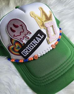 Round beaded sports team trucker hat chain. Your favorite team, colors, and sayings come to life on your favorite trucker hat! From professional sports to little league we have you covered   Please note in comments:  ▪︎What you would like it to say  example: go cards! or jackson #8 ▪︎What color beads with specifics   example: if you want the color green do you want forest, lime, or light green ▪︎Do you want bling or sports beads example: silver or gold beads and football or basketball beads *Approximately 9 to 10 inches *Attaches with lobster claw clasps   *Easily switch out with any of our other chains *Looking for something custom? We do that! Send us a message with your ideas *Are you a business looking for bulk deals? we do that too! Shoot us a message Hat Chain, The Color Green, Color Beads, Team Colors, Gold Beads, Trucker Cap, Favorite Team, Lobster Claw, Sports Team