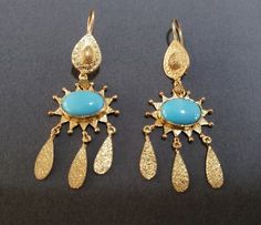 -product type - gold vermeil turquoise earring -material - silver -purity - 925 - details of 1 pair -stone - turquoise -turquoise weight - 7.80 carat -total weight - approx - 8.900 grams -silver weight - 925 - approx - 7.340 grams -turquoise size - 9 x 12 mm Elegant Turquoise Gold-plated Earrings, Turquoise Hallmarked Earrings For Gift, Handmade Gold Plated Fine Jewelry Earrings, Gold Bohemian Clip-on Jewelry, Turquoise Gold-plated Earrings For Gifts, Artisan Gold Oval Earrings, Turquoise Clip-on Jewelry For Gift, Turquoise Clip-on Jewelry Gift, Elegant Handmade Turquoise Earrings