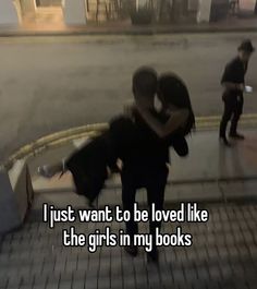 two people hugging each other on the sidewalk with text that reads, i just want to be loved like the girls in my books