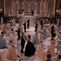 a large group of people in formal dress dancing