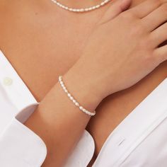 Pairing solid sterling silver beads with genuine freshwater pearls to create a classic yet contemporary look, our Beaded Seed Pearl Bracelet is a terrific addition to your bracelet stack. Made with love in our London studio, this delicate bracelet is the perfect gift for any bride or her bridesmaids.  Available in solid sterling silver and gold filled. Give your jewellery a little TLC to keep your jewellery shining bright. Your beautiful pearl bracelet will be sent to you in a complimentary Lily & Roo gift box. Made in: United Kingdom Elegant Hand-strung Rondelle Pearl Bracelet, Elegant Hand-strung Pearl White Bracelet, Pearl Drop Sterling Silver Bracelet With Round Beads, Sterling Silver Bracelets With Pearl Drop And Round Beads, Classic Polished Pearl Bracelet As A Gift, Classic Single Strand Pearl Bracelet For Everyday, Pearl White Sterling Silver Bracelet With Round Beads, Classic Single Strand Beaded Bracelets For Everyday, Classic Polished Pearl Bracelet As Gift