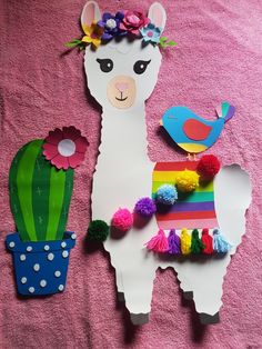 llama, bird and cactus cut out from paper