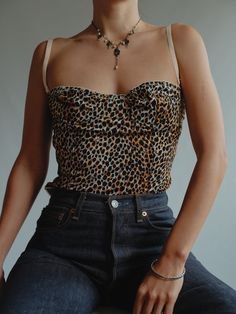 BIODolce and Gabbana Vintage Leopard Print Corset  So fun to style with   tag size FR 42 EU L  Our fit estimate: UK 10-12  Pictured on size 6 5'5 tucked to fit Very Good vintage condition, light wear to be expected of any second hand or vintage item Fitted Leopard Print Tops For Spring, Leopard Corset, Leopard Print Corset, Leopard Trousers, Modern Corset, Corset Styles, Corset Outfit, Vintage Leopard, Corset Fashion