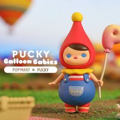 a small toy doll holding a candy lollipop in it's hand with the caption pucky balloon babies