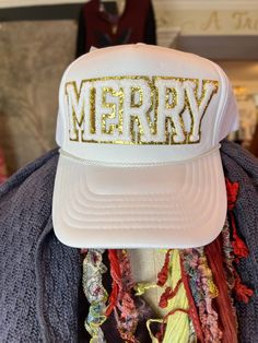 Merry Trucker Hat Experience the holiday spirit in style with our White foam trucker hat, featuring an eye-catching Merry embroidered patch! Enjoy a comfortable fit with the foam front, mesh back, and adjustable snapback enclosure. Artisan Made Adjustable Made in United States Hat Bar, Shreveport Louisiana, Hat Patches, Embroidered Patch, Trucker Hats, Embroidered Patches, Holiday Spirit, The Holiday, Fashion Art