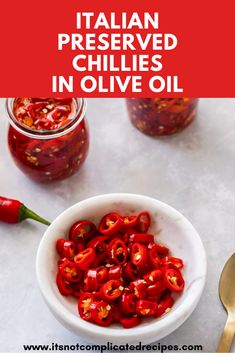 red peppers in a white bowl with text overlay that reads italian preserved chillies in olive oil