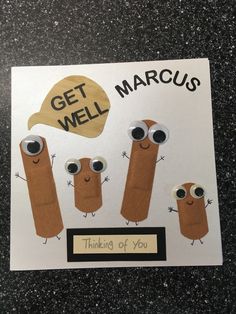 a card with some stickers on it that says get well and three small sausages