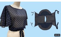 a mannequin wearing a polka dot top next to a piece of clothing that is shaped like a fish