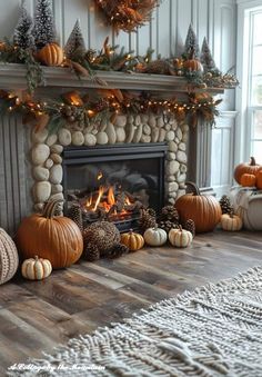 a fireplace decorated with pumpkins and pine cones