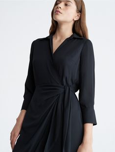 Elevated elegance accentuated by sculptural form. Designed with a wrap-tie detail, this dress features a gentle drape along the leg. Made with long sleeves and a point collar for a refined touch.  Material: 100% Polyester. Wrap Maxi Dress, Maxi Wrap Dress, Calvin Klein, Long Sleeves, Maxi Dress, Collar, Long Sleeve