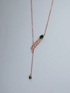 I know it's hard to choose. I can help you a little You will look fabulous with our designer necklaces.💎  🧐The necklace is made with emerald green stone, not real emerald. PRODUCT FEATURES; ✰ Weigth: 2gr ✰ Height: 44 Cm - 17.03 Inches ✰Color🎨: Rose Gold ✰Material: 925 Silver * This carefully made necklace will be a display of simplicity and elegance on your neck. * All of our products are handmade and their materials are 925 sterling silver. 💎MATERİAL * 925 Sterling Silver - Rhodium Plated 🎁IS IT A GIFT? If you wish to send a personal message, please write me at the checkout process! This necklace comes in a beautiful gift package with your personel message . 🧼Care: ★Avoid contact with chemicals ★ Store in moisture free, cool storage ★ Avoid unnecessary contact with water ★ Avoid exe Elegant Green Lariat Necklace As Gift, Rose Gold Lariat Necklace For Gifts, Elegant Green Lariat Necklace, Green Lariat Jewelry With Adjustable Chain, Elegant Adjustable Green Lariat Necklace, Lariat Clavicle Chain Necklace As Gift, Green Dangle Drop Necklace As Gift, Gift Clavicle Chain Lariat Necklace, Clavicle Chain Lariat Necklace As Gift