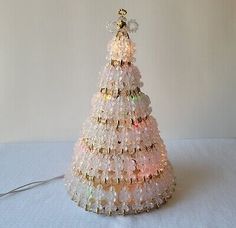 a christmas tree made out of plastic beads