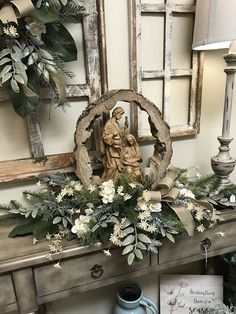 a table with flowers and a statue on it