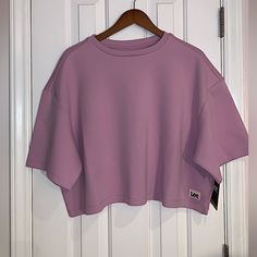 Nice Cropped Short Sleeve Sweatshirt In Sugar Lilic Size Xl, Pit To Pit Measurement 29 Inches Fall Pink Drop Shoulder Top, Oversized Long Sleeve Purple Top, Oversized Purple Long Sleeve Top, Oversized Purple Sporty Tops, Purple Relaxed Fit Casual Top, Heather Casual Top For Loungewear, Lavender Relaxed Fit Casual Top, Casual Pink Boxy Fit Top, Sporty Oversized Purple Tops