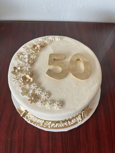 a 50th birthday cake with the number fifty on it