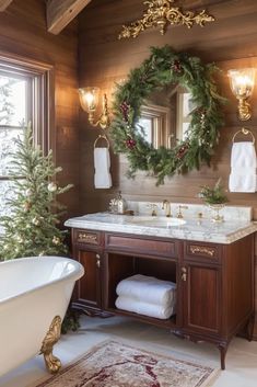 a bathroom decorated for christmas with wreaths on the wall and bathtub in front