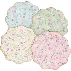 four decorative plates with flowers on them