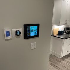 an appliance mounted to the wall in a kitchen