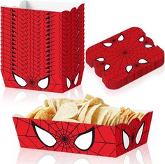 a red box filled with tortilla chips and a spiderman mask on it