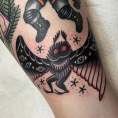 an artistic tattoo on the leg of a person