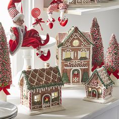 christmas decorations and gingerbread houses are on display