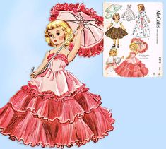 a paper doll with an umbrella and dress