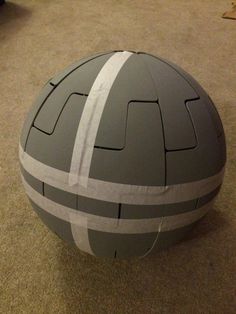 a large gray and white ball sitting on the floor