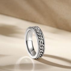 Made from high-quality 925 sterling silver, this band perfectly combines style with function. The rotating design adds a fun element to this band. Each turn symbolizes the memories and experiences that have shaped you into the extraordinary individual you are today. Wear this band with pride. Because it represents your commitment to embracing life’s journey and cherishing the moments that matter most.Weight: 4 gWidth: 5 mmHeight: 2.3 mmThickness: 2 mmMaterial: 925 SilverPlating Color: Silver Elegant Silver Stackable Chain Ring, Stainless Steel Chain Jewelry For Anniversaries, Fine Jewelry Silver Double Band, Classic Silver Chain Ring With Adjustable Size, Classic Silver Chain Ring With Adjustable Chain, Classic Silver Chain Ring Adjustable, Silver Adjustable Chain Classic Ring, Classic Stainless Steel Jewelry With Thick Band, White Gold Jewelry With Thick Band For Promise