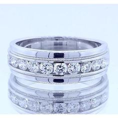 a wedding ring set with four rows of diamonds on top of each other in white gold